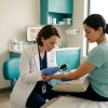 Nurse Practitioner evaluating a patient’s skin health concern